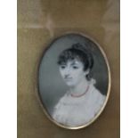 A 19th century miniature portrait of a lady on ivory, set in a gilt wood frame Location: 6.2