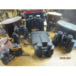 A group of cased binoculars to include a leather cased Carl Zeiss Jena Jenoptem 8x30 W binoculars,