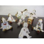 Seven Royal Crown Derby models to include two rag dolls, two clowns, a teddy, a rabbit and a rocking