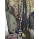 A selection of fishing items to include several rods, boxed reels, hooks, cases and other items