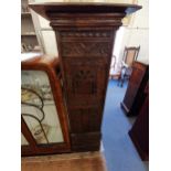 A carved oak cabinet, 147 h x 52 w x 29cm d Location: RAB