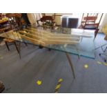 A Frag Italian designer glass top dining table, raised on steel legs joined by Beech supports and