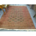 A hand woven Middle Eastern carpet, the centre with multi elephant gulls on a black ground,