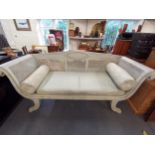 A Regency style caned three seater scroll end sofa, raised on scrolling reeded legs, 92 h x 191 w