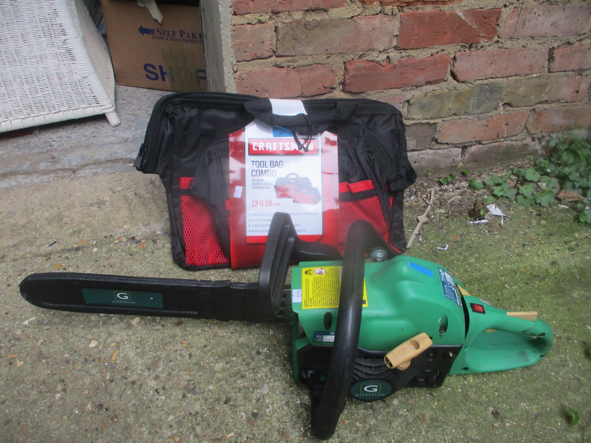 A Gardenline chainsaw together with a craftsman tool bag