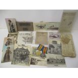Militaria to include two World War I medals stamped M17716 EW Collette AR MTE RN, cards and papers