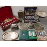 Silver plate to include two canteens of cutlery, a tazza with glass liner, a Skinner & Co tea caddy,