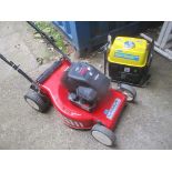 A Laser by Mountfield Omega 46 lawnmower together with a Powercraft 720W generator and accessories