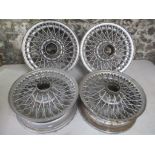 A set of four Curly Hub, 15 x 5 inch alloy wheels, possibly from a Jaguar
