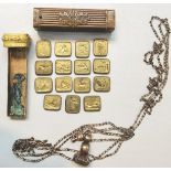 A Victorian set of fifteen fob seal tablets in brass case fashioned as a classical pilaster,
