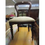 Two reproduction mahogany balloon back dining chairs with upholstered seats on turned and fluted