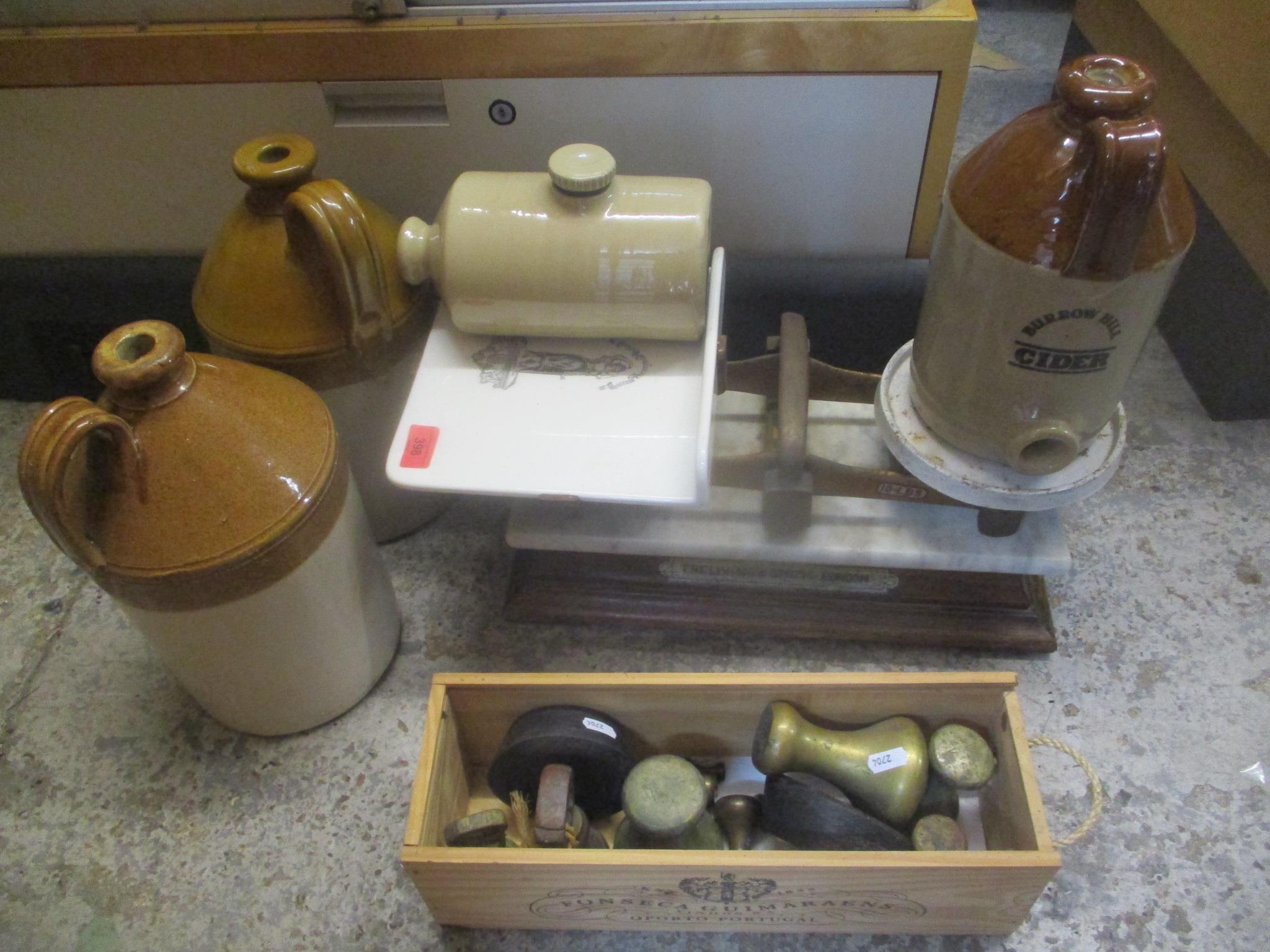 A set of Victorian weighing scales on an oak base, together with weights, a stoneware hot water