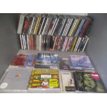 A large quantity of mixed CDs to include Queen, Bryan Adams, Lady Gaga and many others