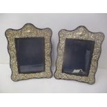 A pair of late 20th century silver fronted photograph frames with embossed decoration, 28cm h x 21cm