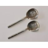 A pair of Chinese silver spoons in the form of fans with bamboo handles, stamped sterling 950,