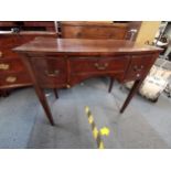 A 19th century mahogany desk/side table with three drawers raised on tapered legs 76cm h x 90cm w