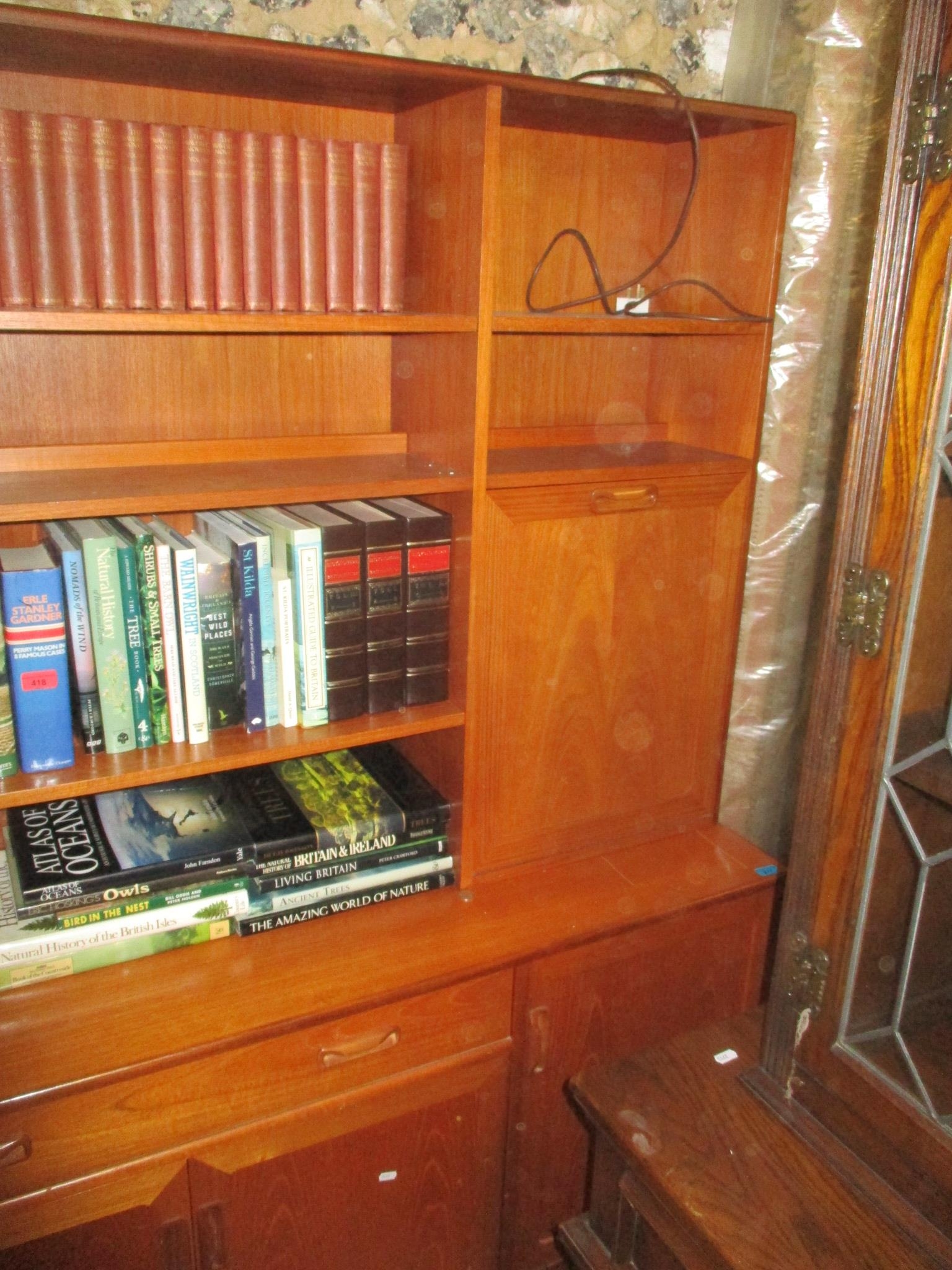 A mid-century G-Plan teak display cabinet having open shelves, cocktail cabinet, glazed door with - Image 3 of 3