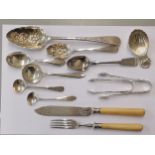 Silver to include two Georgian berry spoons, two Georgian teaspoons, a Victorian teaspoon, a caddy