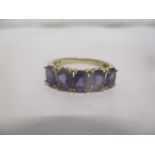 A 9ct gold ring set with six amethyst, 3g