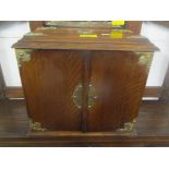 A late Victorian oak two-door smoker's cabinet fitted with three drawers 28cm h x 31.5cm w