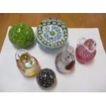 A group of five glass paperweights to include a millefiori and Strathearn examples Location: RAB