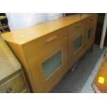 A vintage Ornen Mobelfabrikken teak sideboard having three drawers above the cupboard doors with