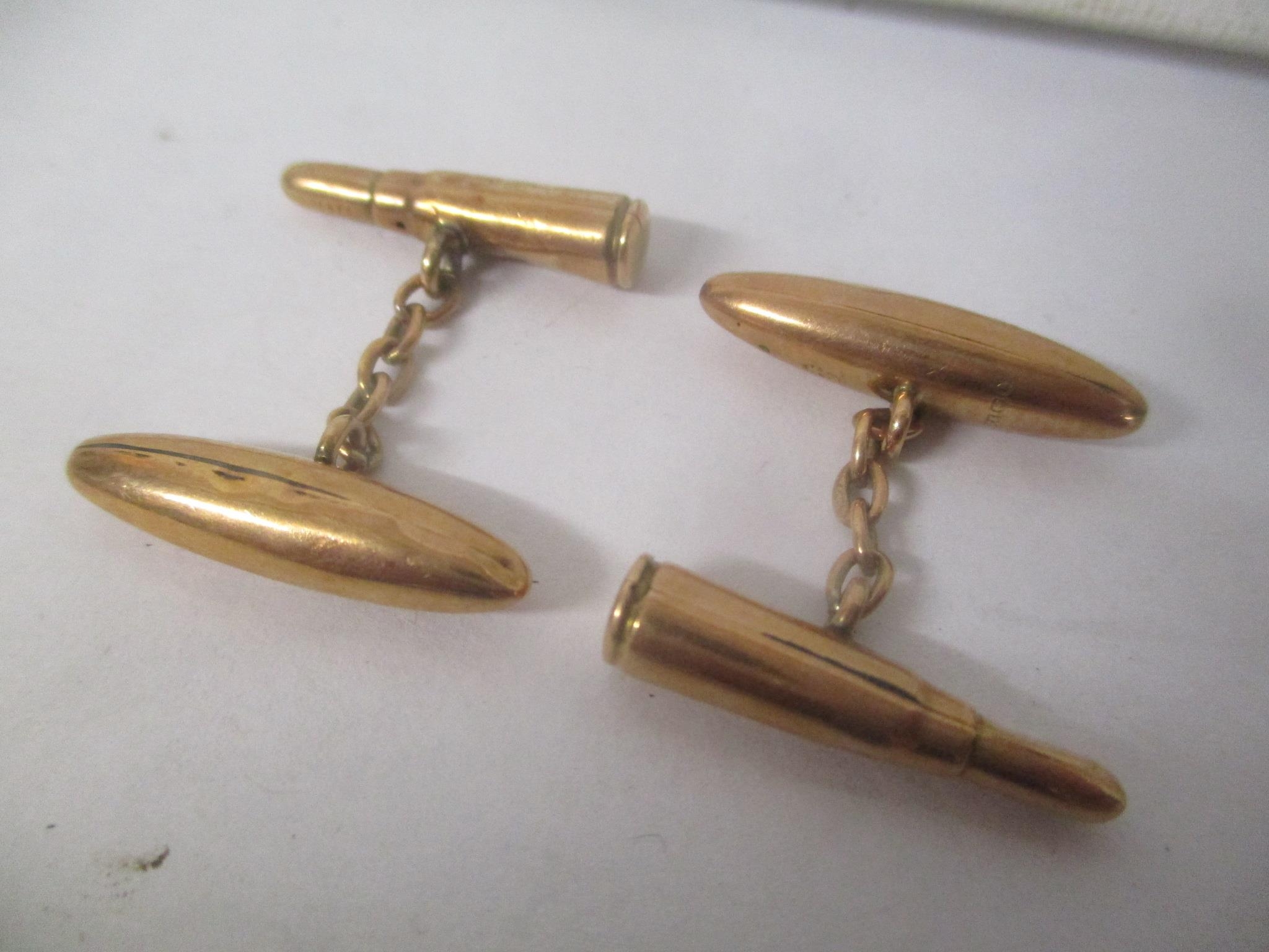 A pair of 9ct gold cufflinks fashioned as bullets 3.4g