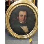 A 19th century oval portrait of a gentleman, oil on canvas laid onto board, set in gilt wood frame