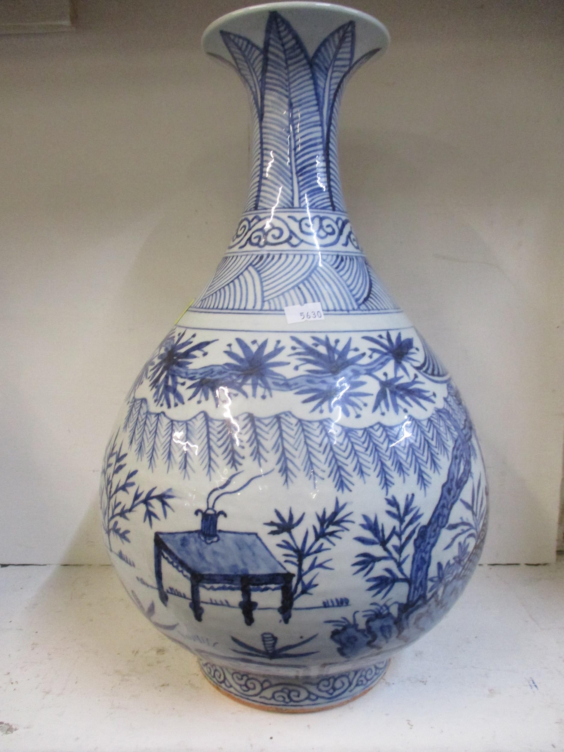 A 20th century Chinese blue and white vase depicting images in a garden, 42cm high together with a - Image 2 of 5