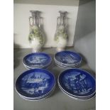 A pair of circa 1900 floral decorated vases and a set of 13 Royal Copenhagen Christmas plates from