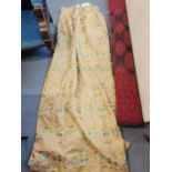 A pair of good quality triple pleat and lined curtains, with a turquoise floral design and a gold