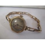An early 20th century 9ct gold ladies wristwatch on a 9ct gold expanding bracelet 22.6g