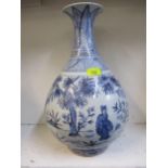 A 20th century Chinese blue and white vase depicting images in a garden, 42cm high together with a