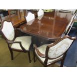 A Bridgecraft mahogany extending dining table together with six matching dining chairs and two