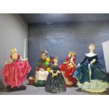 A group of five Royal Doulton figurines to include Delight HN1772, The Old Balloon Seller HN1315,