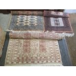 Three small Bokhara rugs to include one with elephant foot motifs and multi guard boarders, 80 x