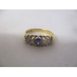 An 18ct gold sapphire and diamond inset ring 2.7g
