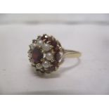 A 9ct gold Garnet and pearl ring, 2.8g