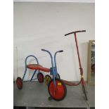 A vintage Triang trike in red and blue colours, and a Mobo scooter in red with yellow wheels