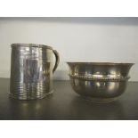 A silver christening mug with horizontal banded decoration, engraved 'John Robertson 27 Jan 1909',