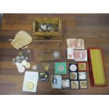 A selection of coinage, banknotes and medals, mostly in a wooden box inscribed Presented to