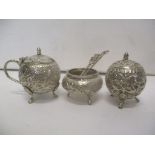 An Indian silver condiment set comprising a pepper, a salt, a mustard and two spoons, 120g