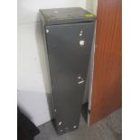 A gun safe, 130cm h x 25.5cm w. ley only works for one lock