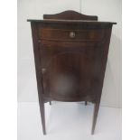 An early 20th century inlaid mahogany bow front bedside cabinet with a drawer and a door, 79.5cm h x