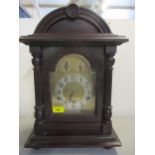 An early 1920's mahogany cased and arched top, 8 day mantel clock, striking on five rods Location:
