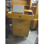 A mid 20th century vintage retro teak tallboy chest of six drawers, the top drawer having a