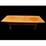 A Dalescraft mid 20th century teak coffee table of rectangular form with curved edges, 44.5h x 151.