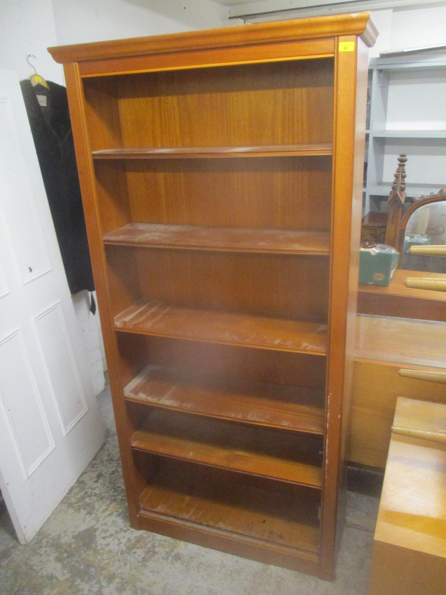 A modern William Lawrence of Nottingham walnut finished tall bookcase with five loose shelves 194.