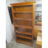 A modern William Lawrence of Nottingham walnut finished tall bookcase with five loose shelves 194.