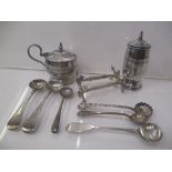 Silver condiments to include a pepper and a mustard, three mustard spoons, three salt spoons and a